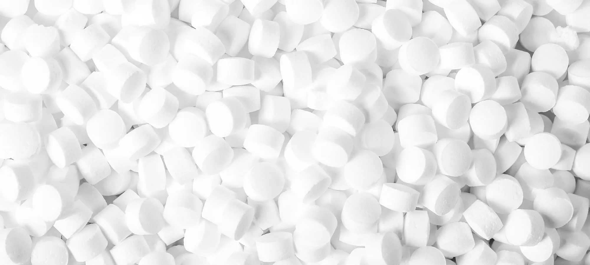 A close-up of white salt pellets